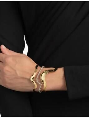 Modern Gold Tone Wave Cuff Bracelet with Silver Chain Accent